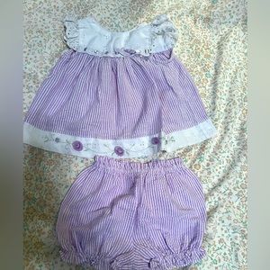 6-9 months purple and white with flowers. Sleeveless outfit with bloomers. $10